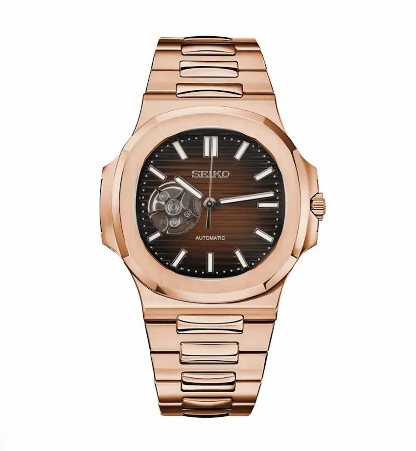Rose gold Seiko watch with a black face on a white background