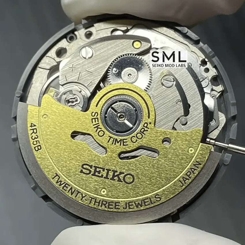 Close-up of a Seiko watch mechanism with 'SML Seiko Mod Labs' branding.